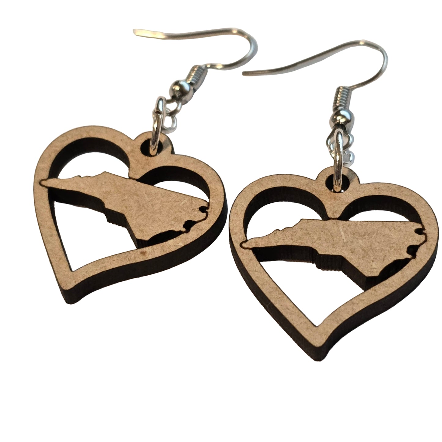 Wooden earrings with a silhouette design on a beige background