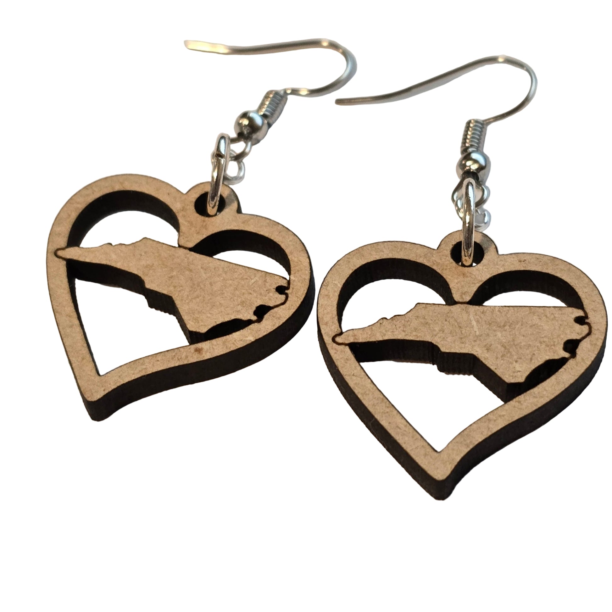 Wooden earrings with a silhouette design on a beige background