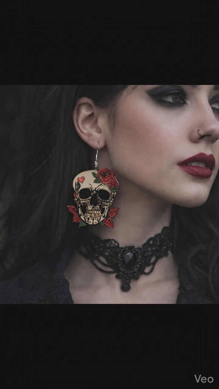 A close-up video of a woman in gothic attire; she slightly turns her head, causing her large skull-and-rose earring to sway gently against her dark, wavy hair.