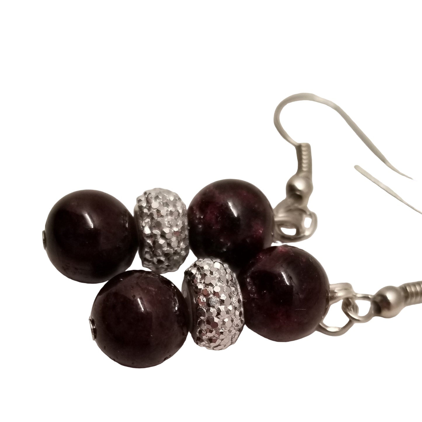 Beaded earrings with dark beads and silver accents on a light background