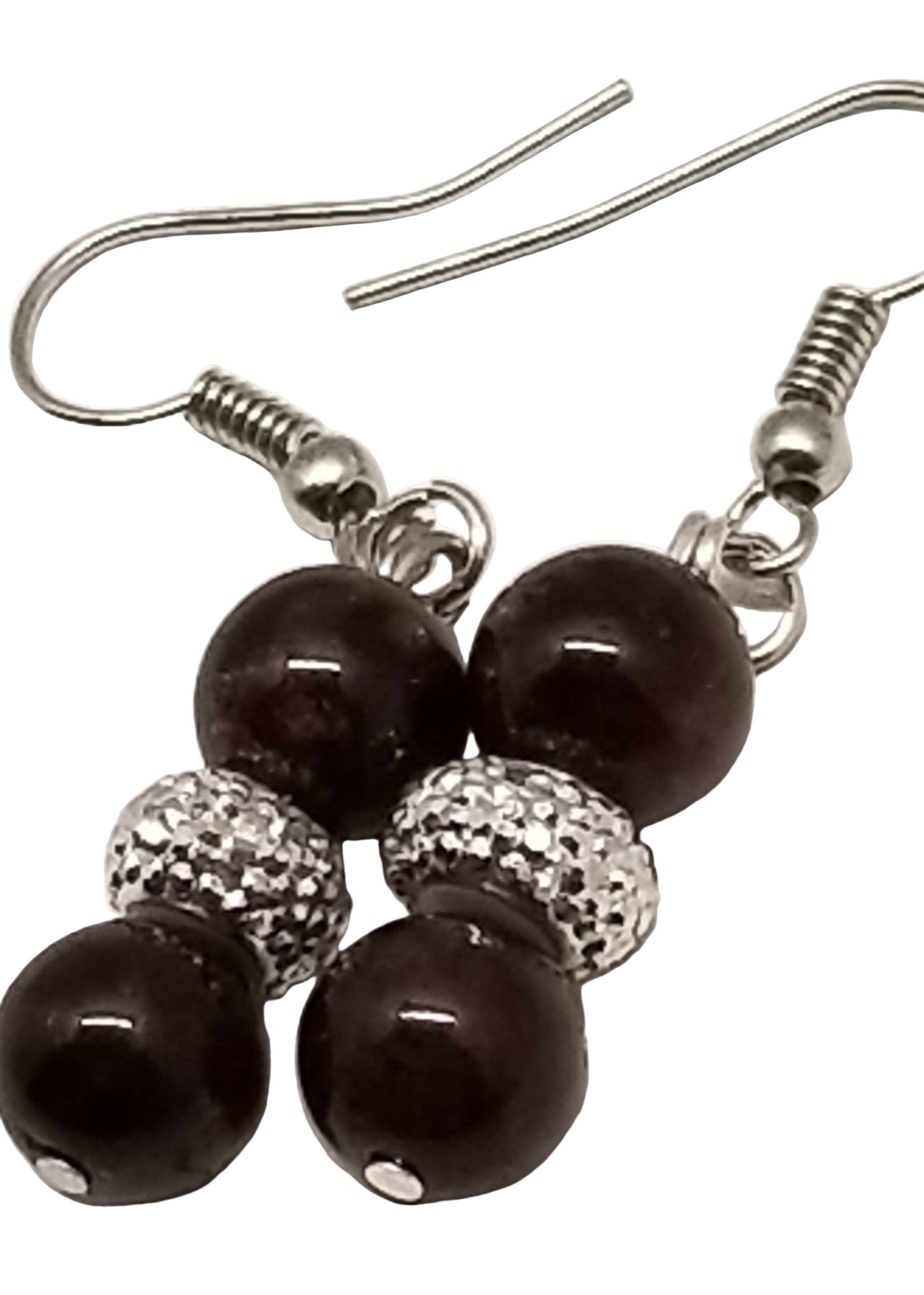 Pair of earrings with dark beads and silver accents on a white background