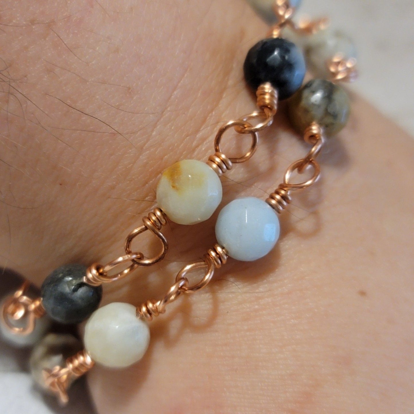 Close-up of a bracelet with beads on a wrist
