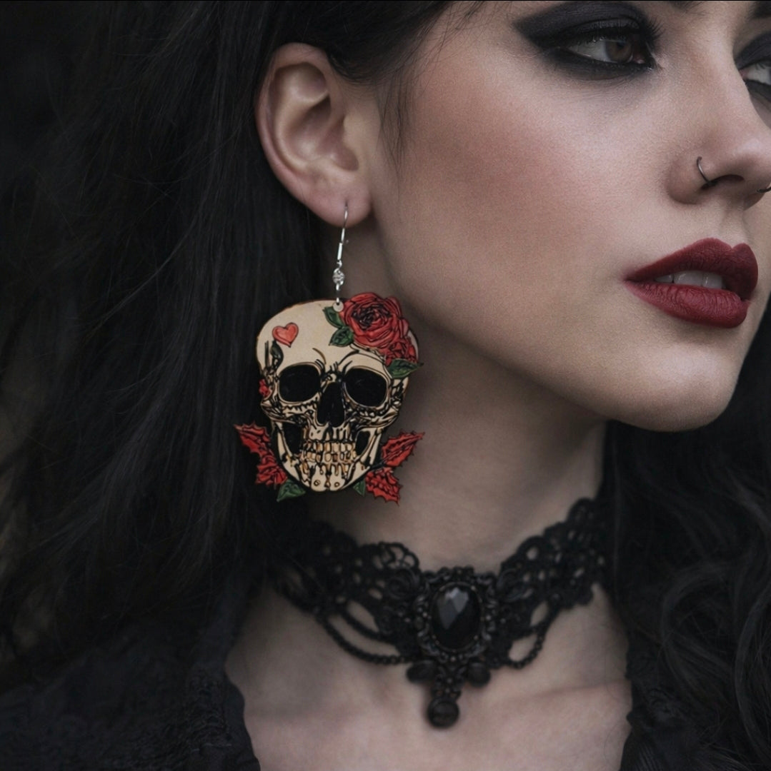 Close-up of a woman wearing skull-themed earrings and a black lace choker.