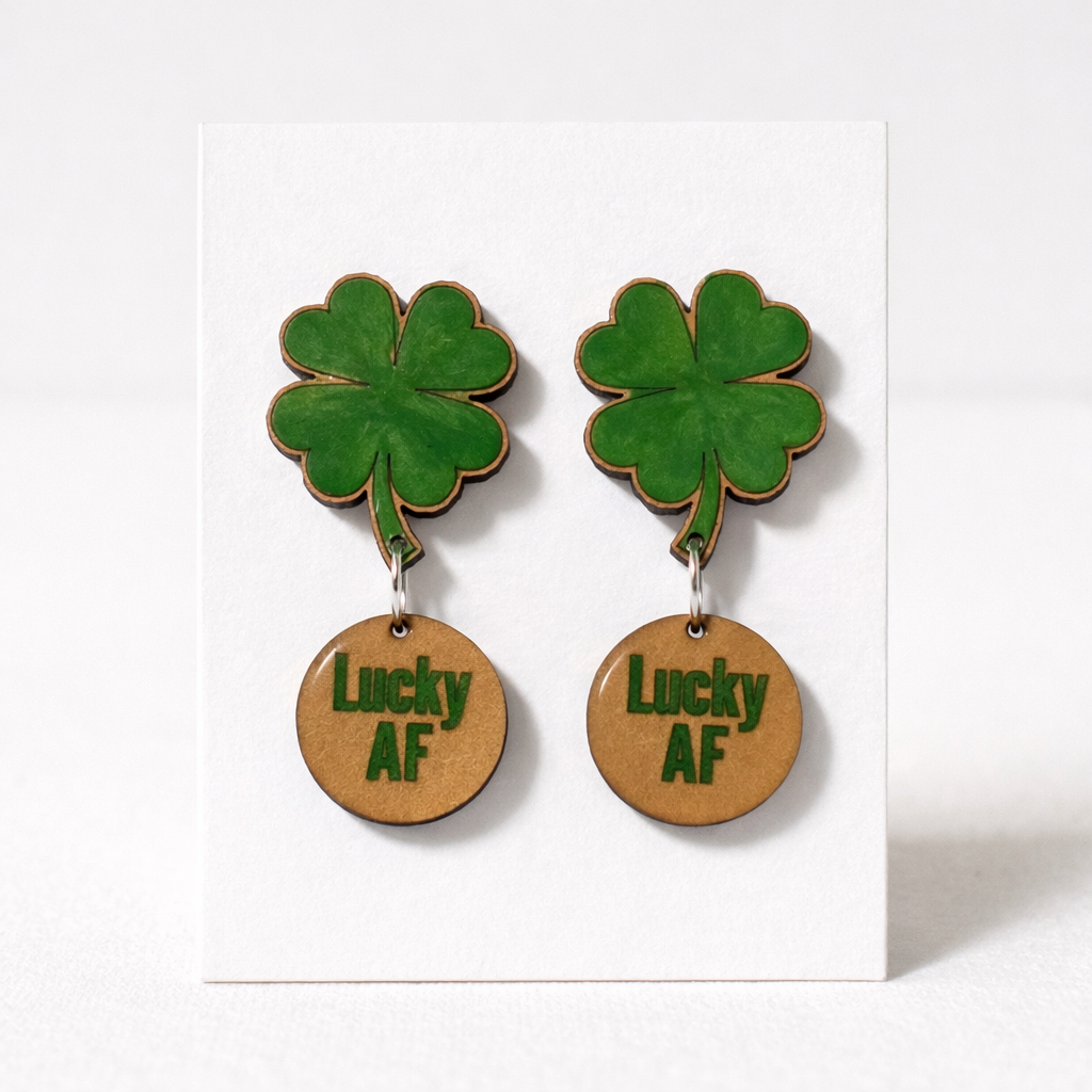 Four-leaf clover earrings with 'Lucky AF' on a white background