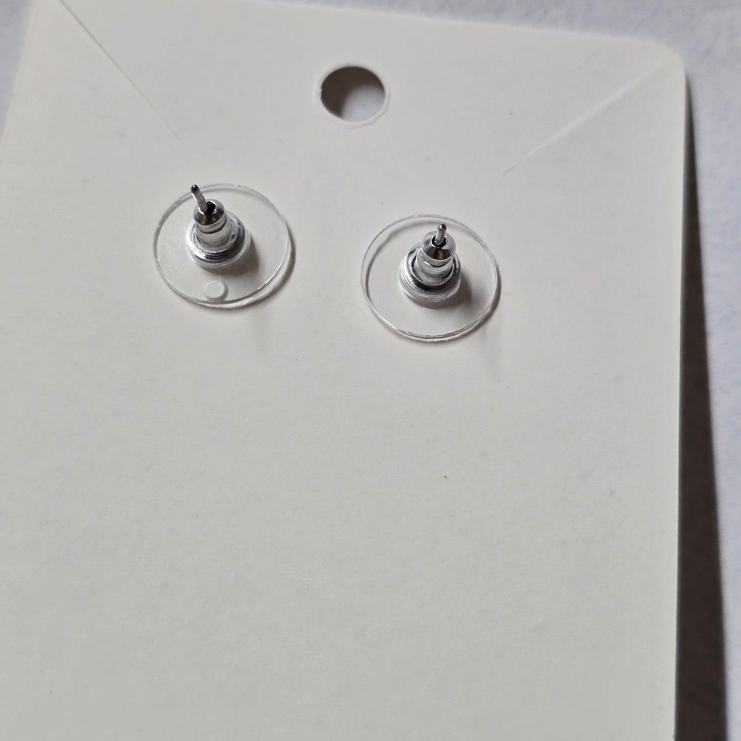 Close-up of a white wall socket with two coaxial cable connectors.