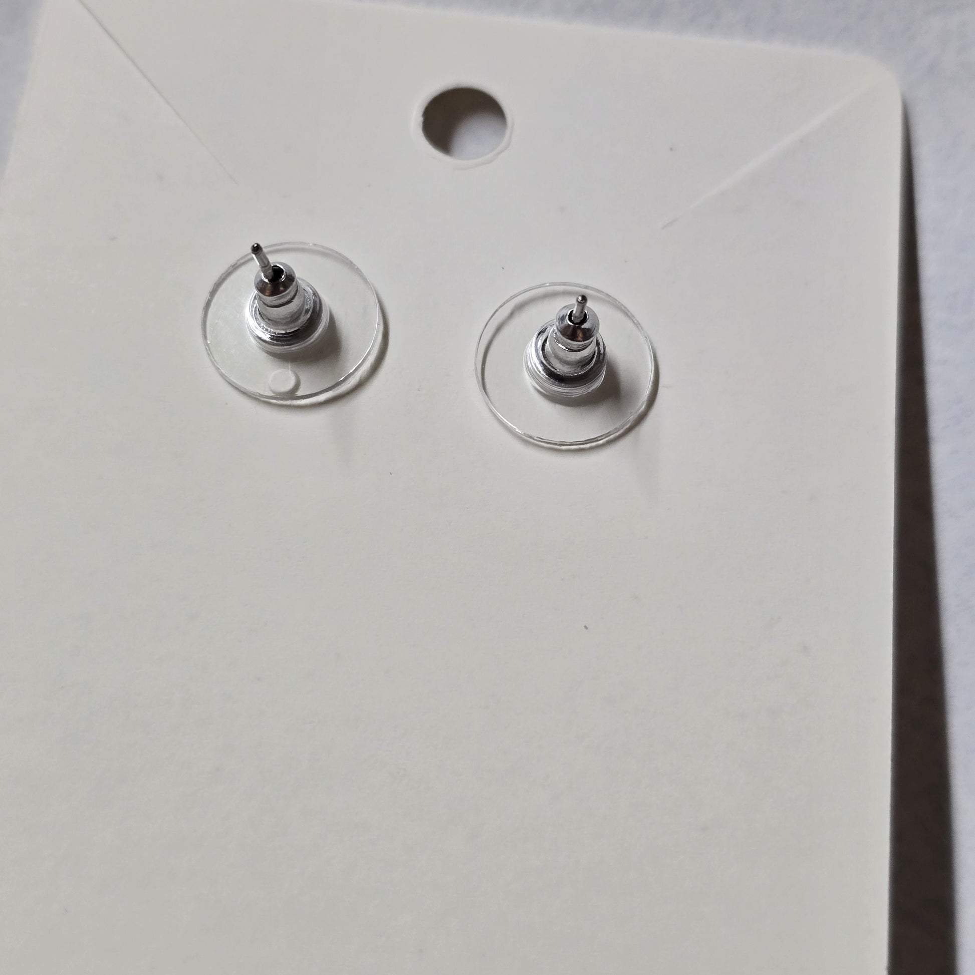 Close-up of a white wall socket with two coaxial cable connectors.