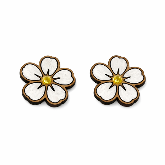 Flower-shaped earrings with white centers and brown outlines on a white background